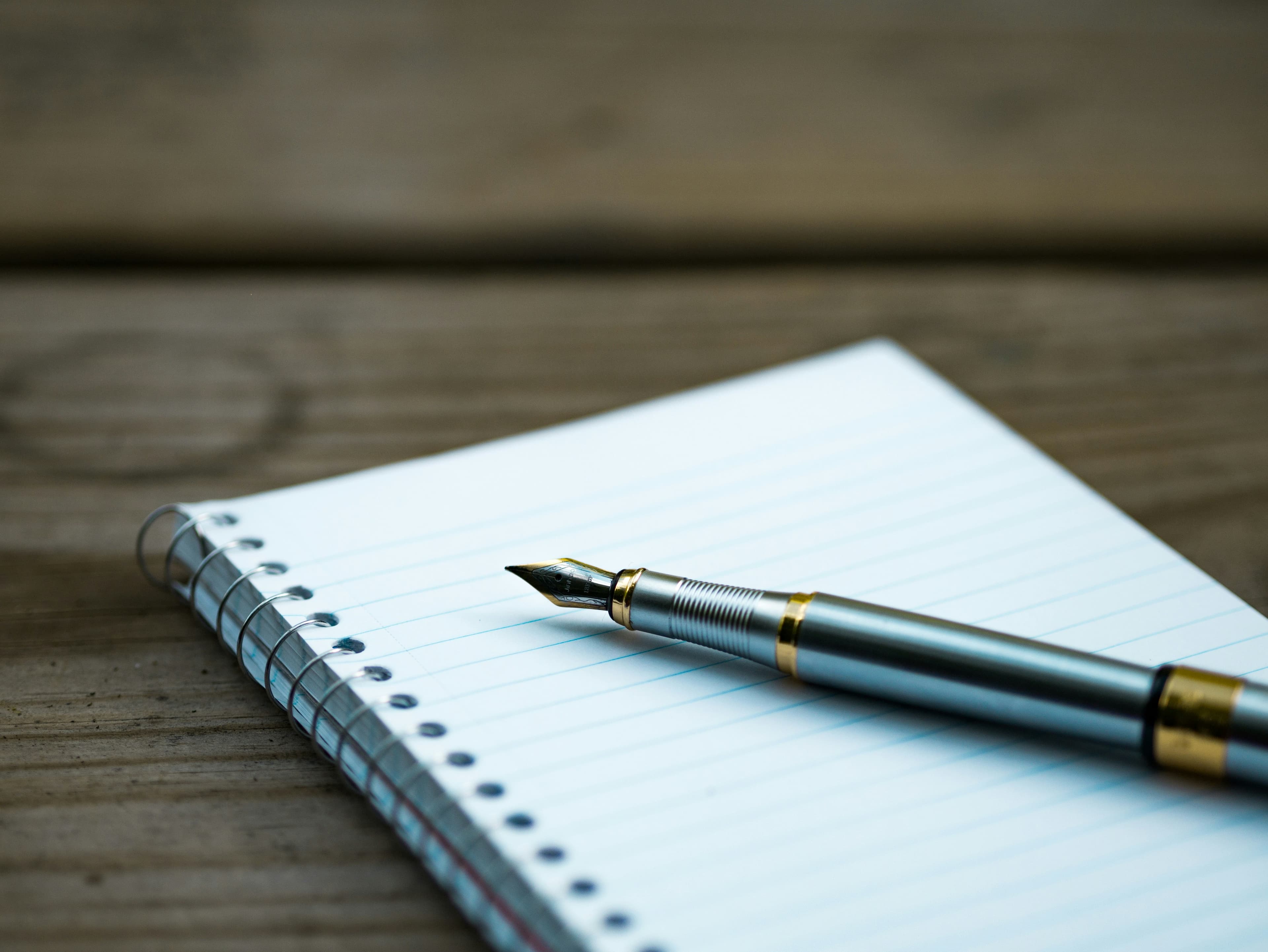 A peaceful notebook and pen, inviting you to journal